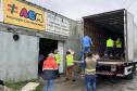 Cestas básicas arrecadadas na Corrida do Porto são distribuídas em Paranaguá