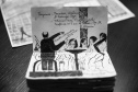 Fã da Orquestra Sinfônica do Paraná e de Beatles, artista ilustra concertos há mais de uma década