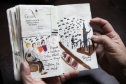 Fã da Orquestra Sinfônica do Paraná e de Beatles, artista ilustra concertos há mais de uma década