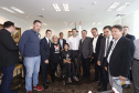 O governador Carlos Massa Ratinho Jr assinou no Palácio Iguaçu, decreto prorrogando a isenção do transporte para PCD (Pessoa Com Deficiência). Presentes na solenidade: prefeito de Curitiba, Rafael Greca de Macedo; secretário de Desenvolvimento Urbano, João Carlos Ortega; diretor presidente da Comec, Gilson dos Santos, entre outros.Curitiba, 09-04-19.Foto: Arnaldo Alves / ANPr.
